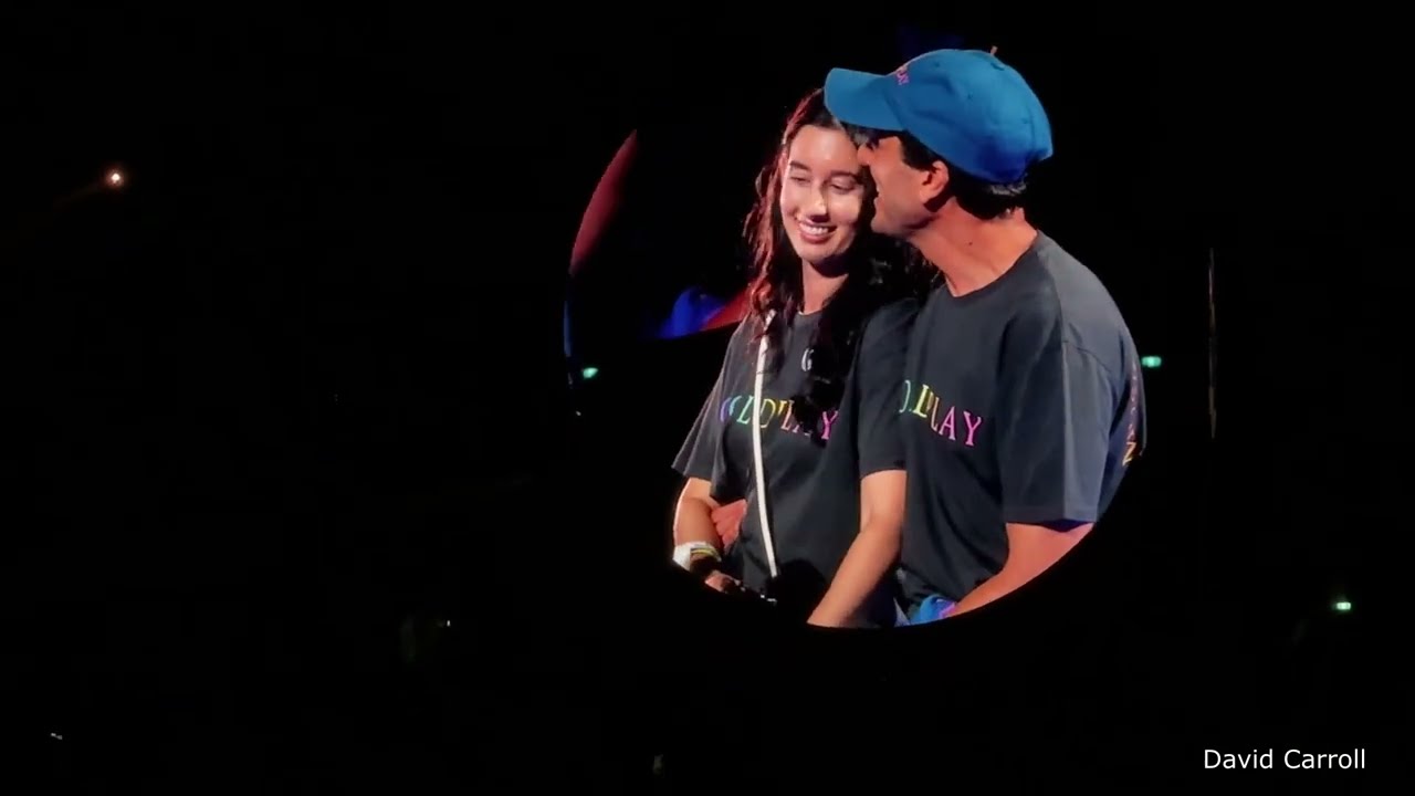 Everglow - Coldplay Chris Martin reads signs and brings fans on stage for Benji