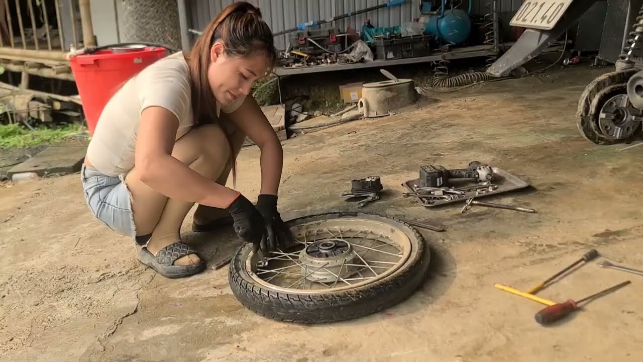 Country Girl Repairs Tires and Replaces Lubricants for Motorcycles