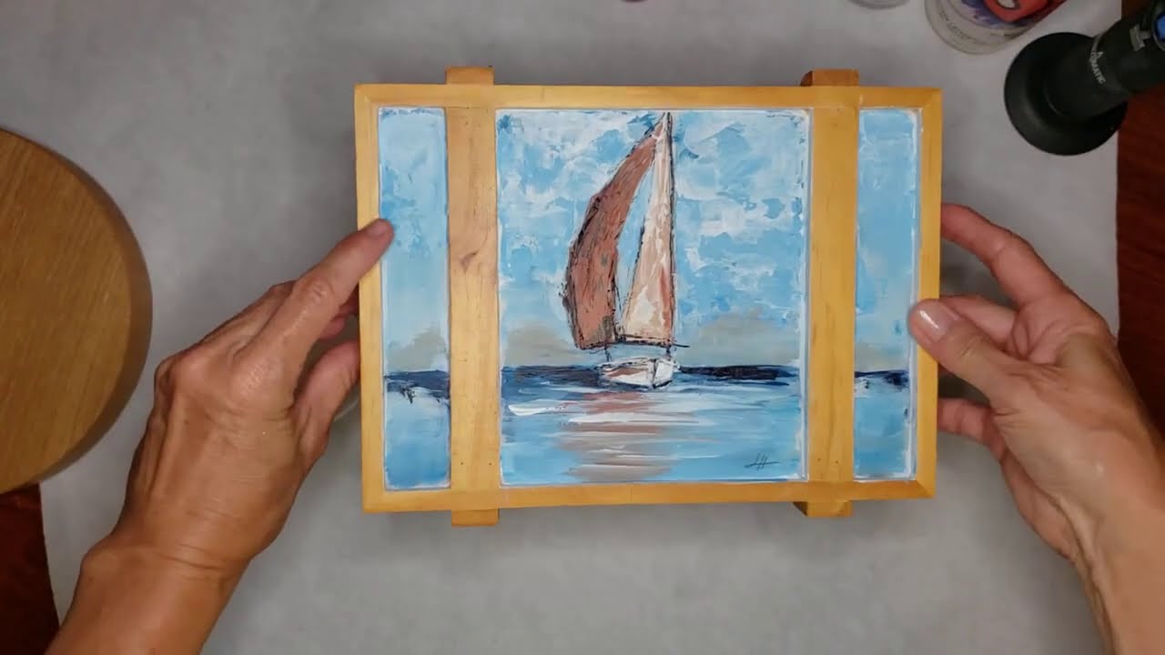 Resining a sailboat and canoe painting on a cigar box (1 of 3)
