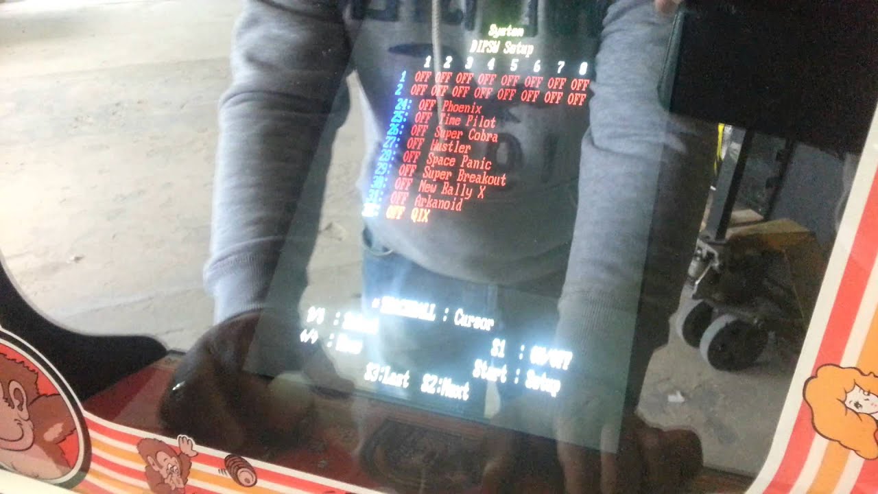 Adjusting settings on a 60-in-1 arcade PCB