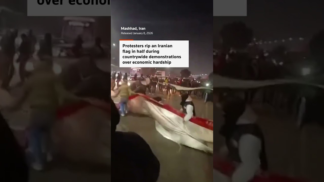 Iranians rip national flag in protest against economic hardship
