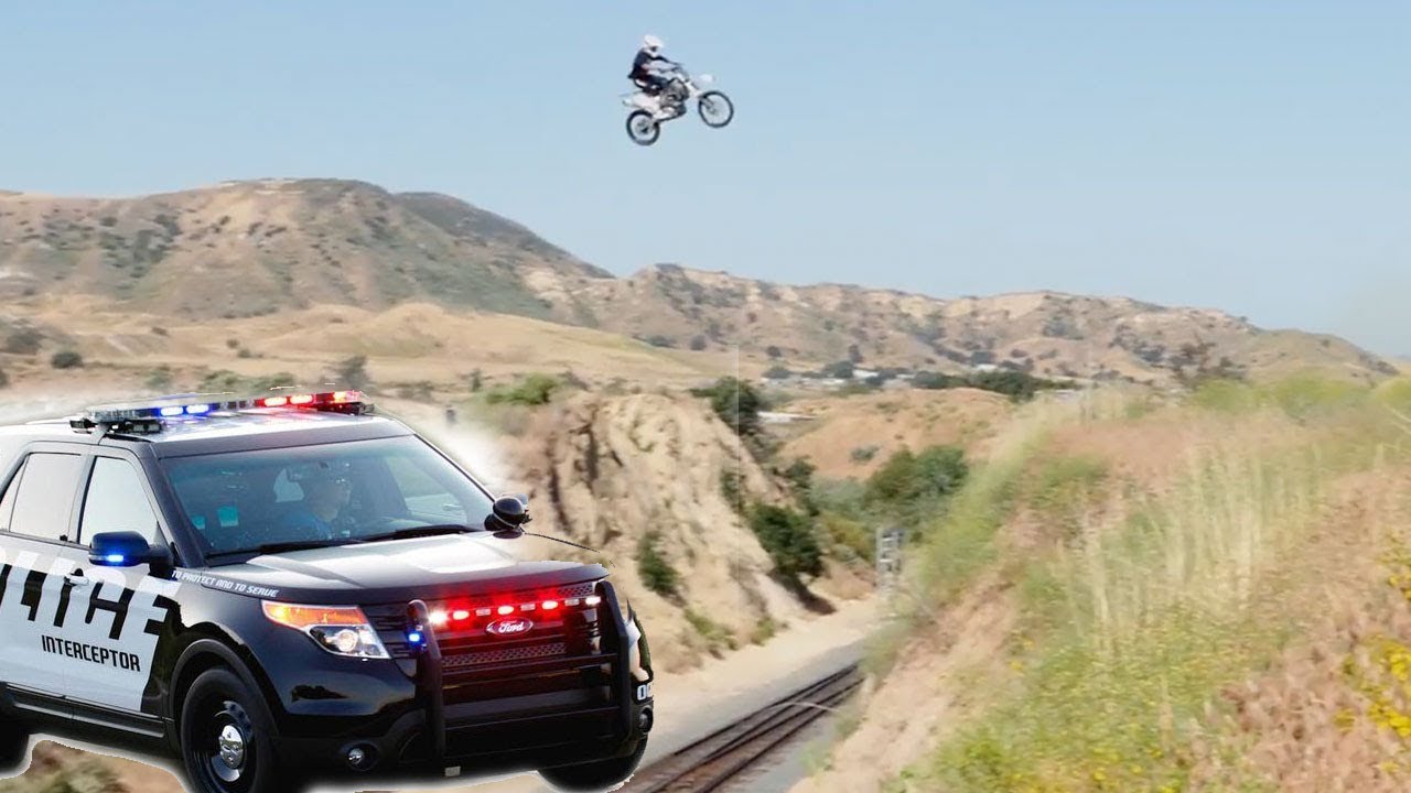 Motorcycle Escapes Police by Jumping over Train Tracks