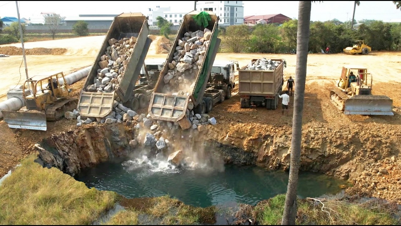 Well Done!! Perfectly Work Teams Bulldozers and Trucks Additional More Stones Protect Raining Flood