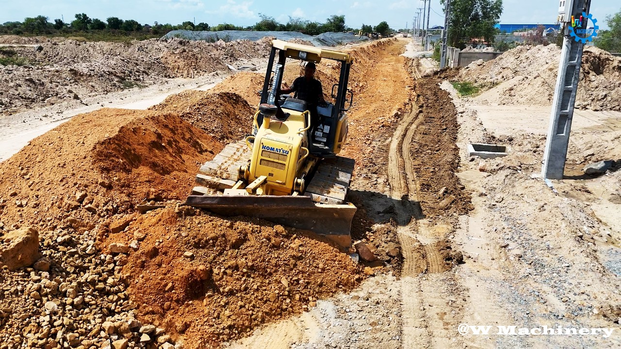 Nicely Action Komatsu Dozer Pushing Rocks Soil Installing Foundation Village Roads Operator Skills