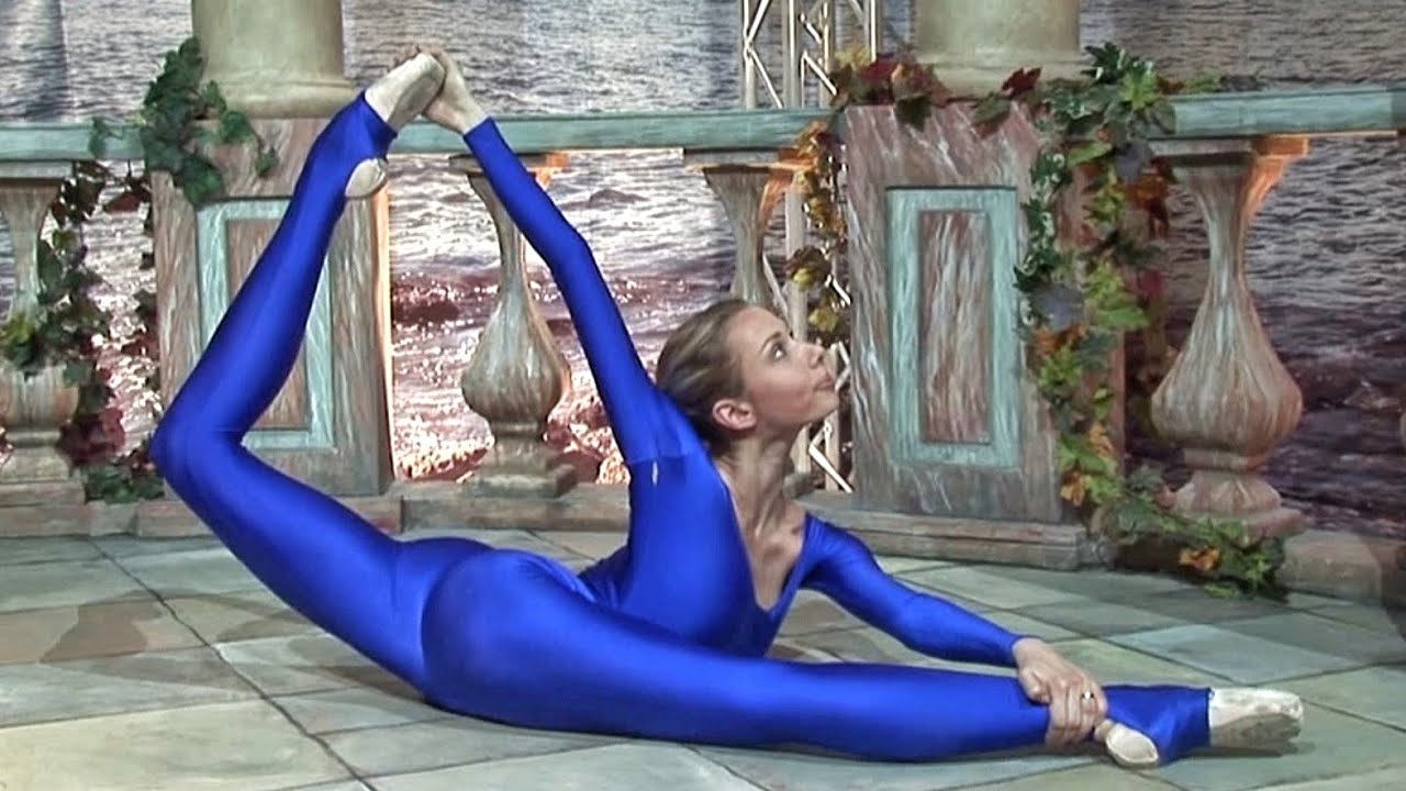Flexible ballerina doing stretching. Training oversplits.