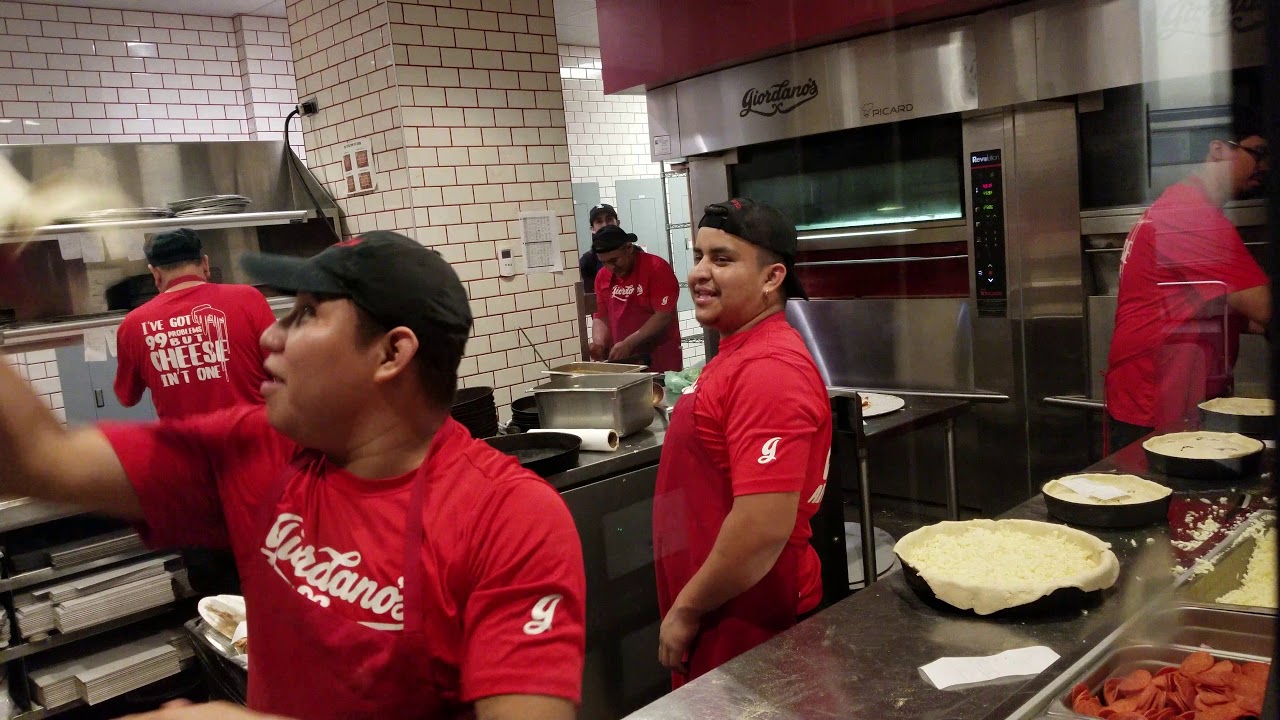MAKING PIZZA AT GIORDANOS PIZZA CHICAGO IL 2