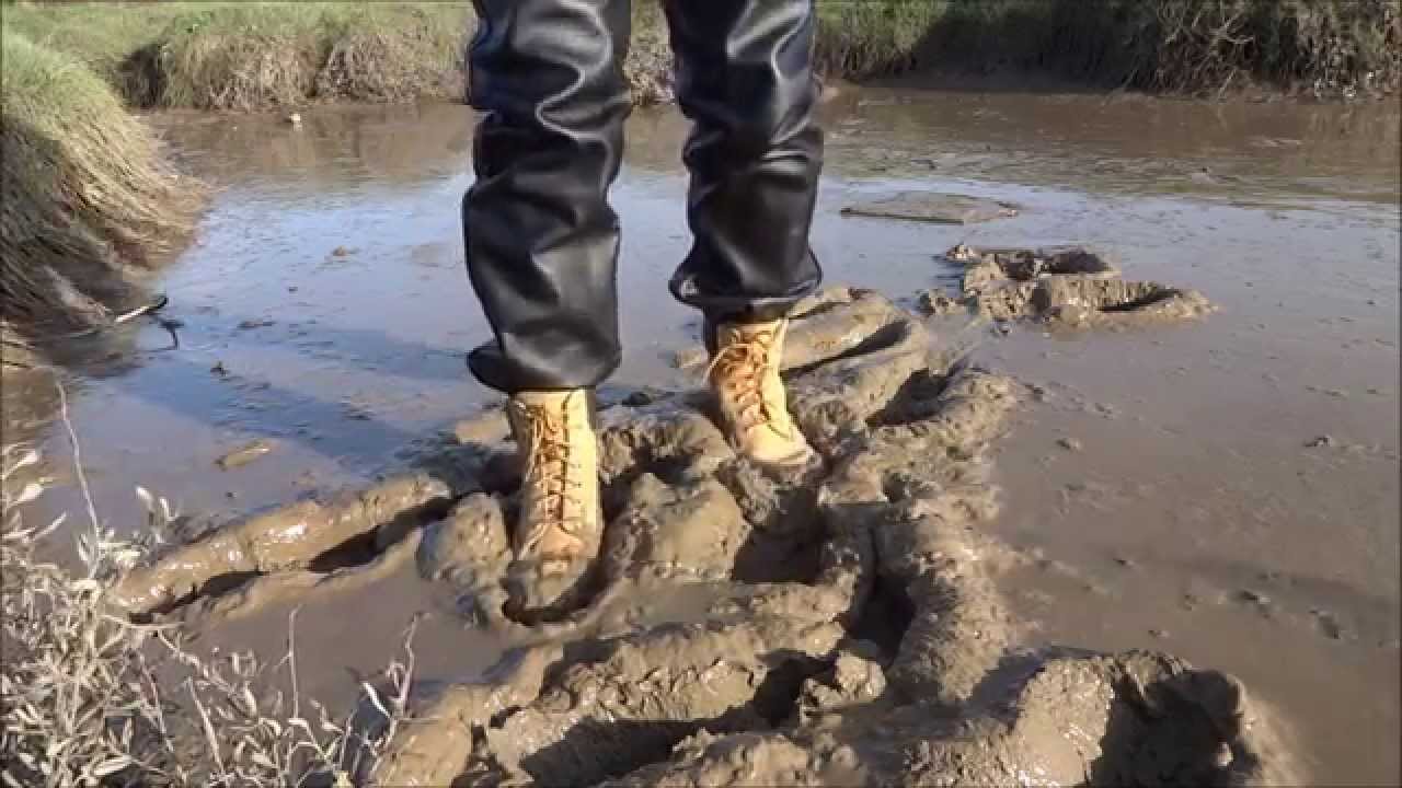 Booted in estuary mud
