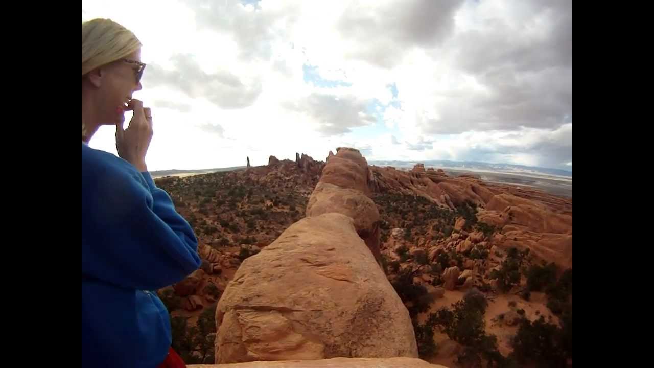 Arches National Park, walking on top of Double-O Arch in Moab, UT