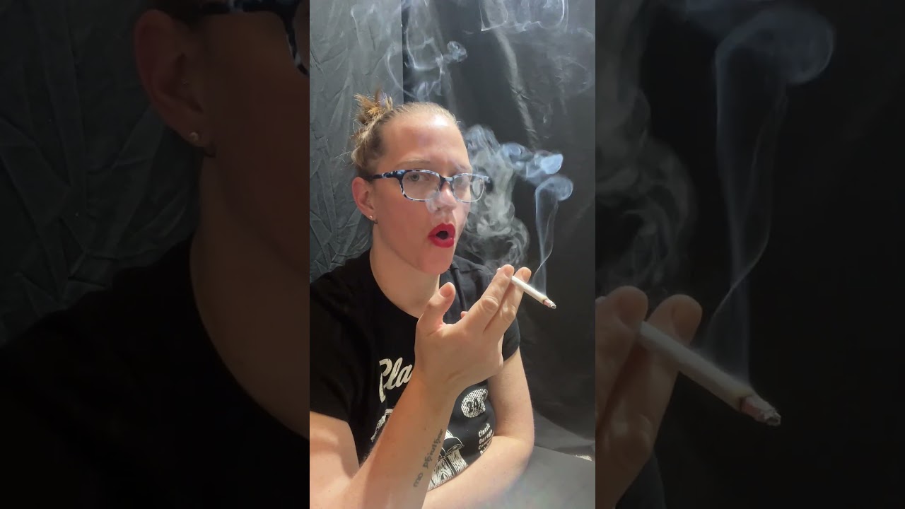 Smoking Layla Smoking Fetish Model is dangling And smoking hands free close up smoking