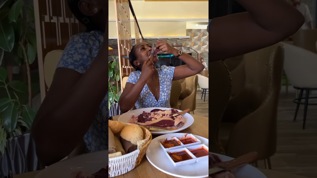 Ethiopian girl eating raw meat