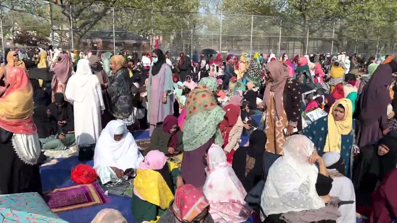 Muslim People on theirs way for Eid prayer at Thomas A. Edison High School field,New York,USA.