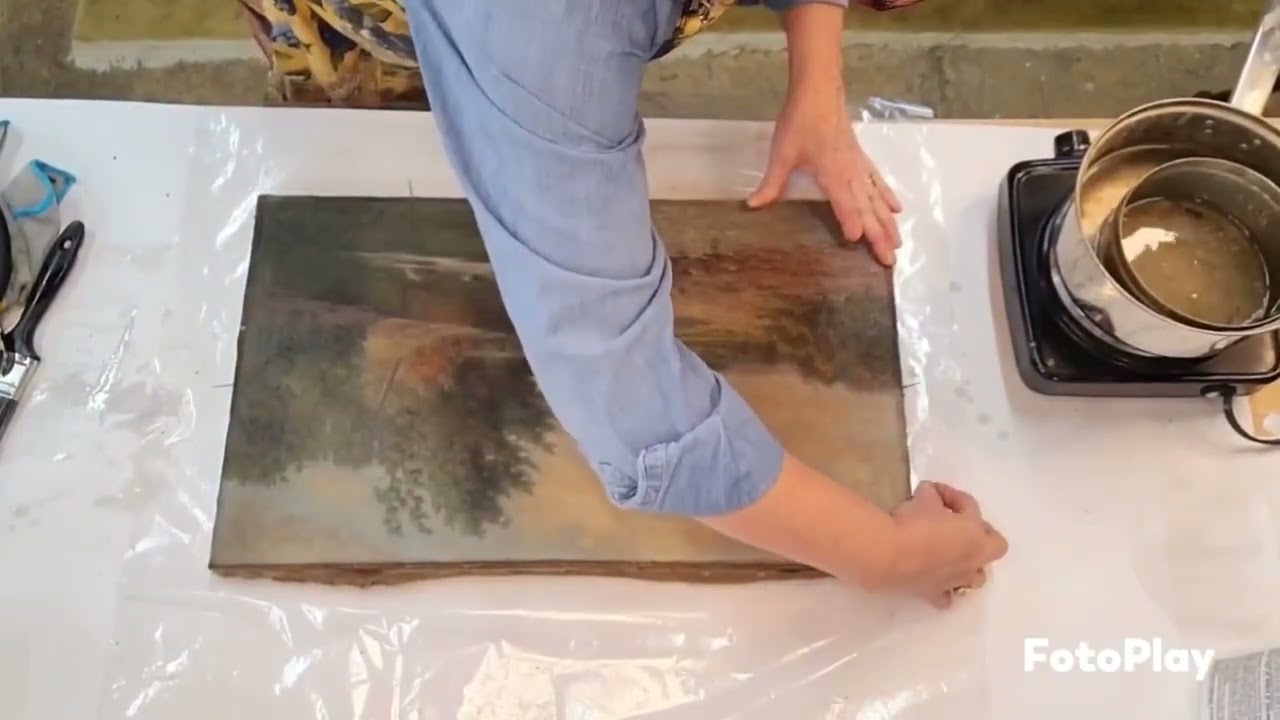 Repairing cracks in an oil painting