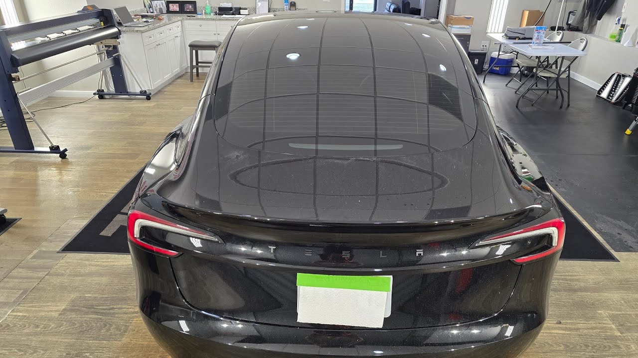 What it looks like to tint the partial rear window on the Tesla Model 3 up to top defroster line.