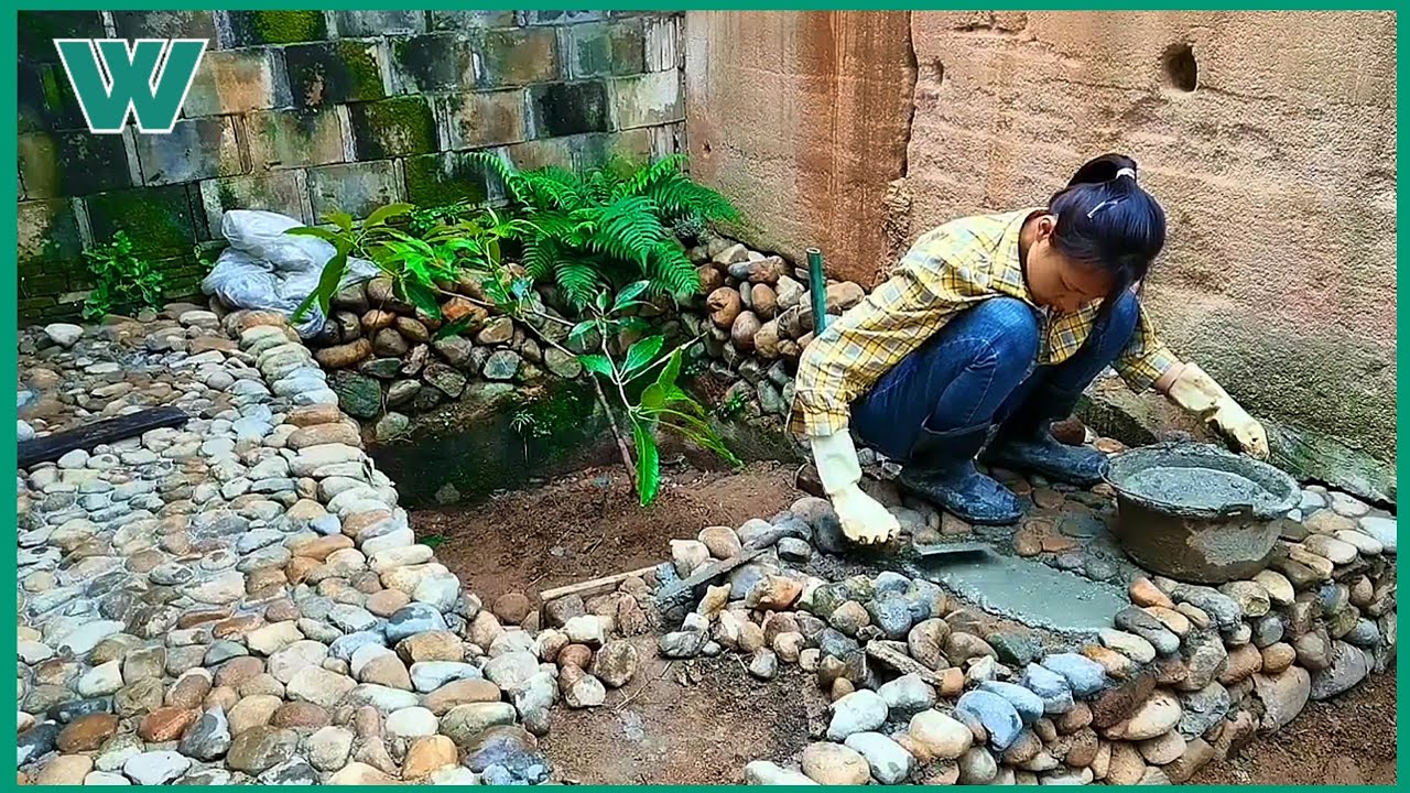 Young girl building and renovating a beautiful small garden with her own hands | workers HD