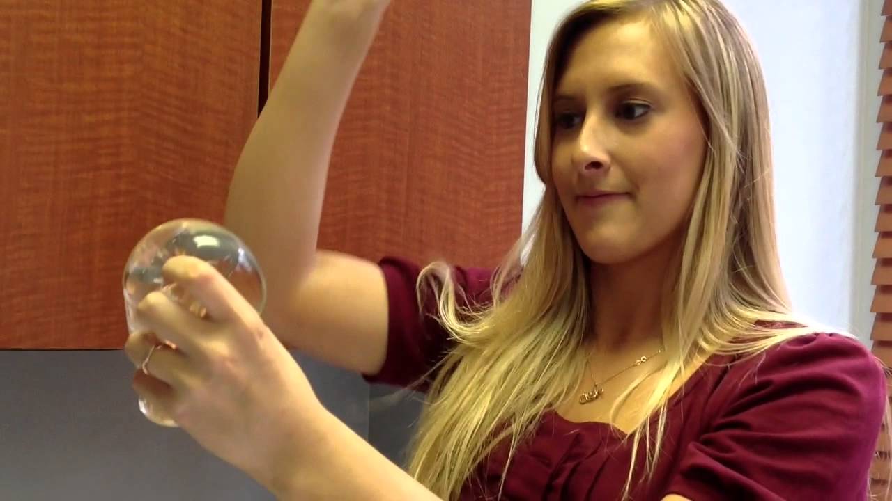 DAVinci Plastic Surgery medical assistants try to pop a silicone breast implant
