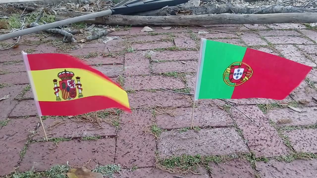 Spanish and Portuguese flags waving