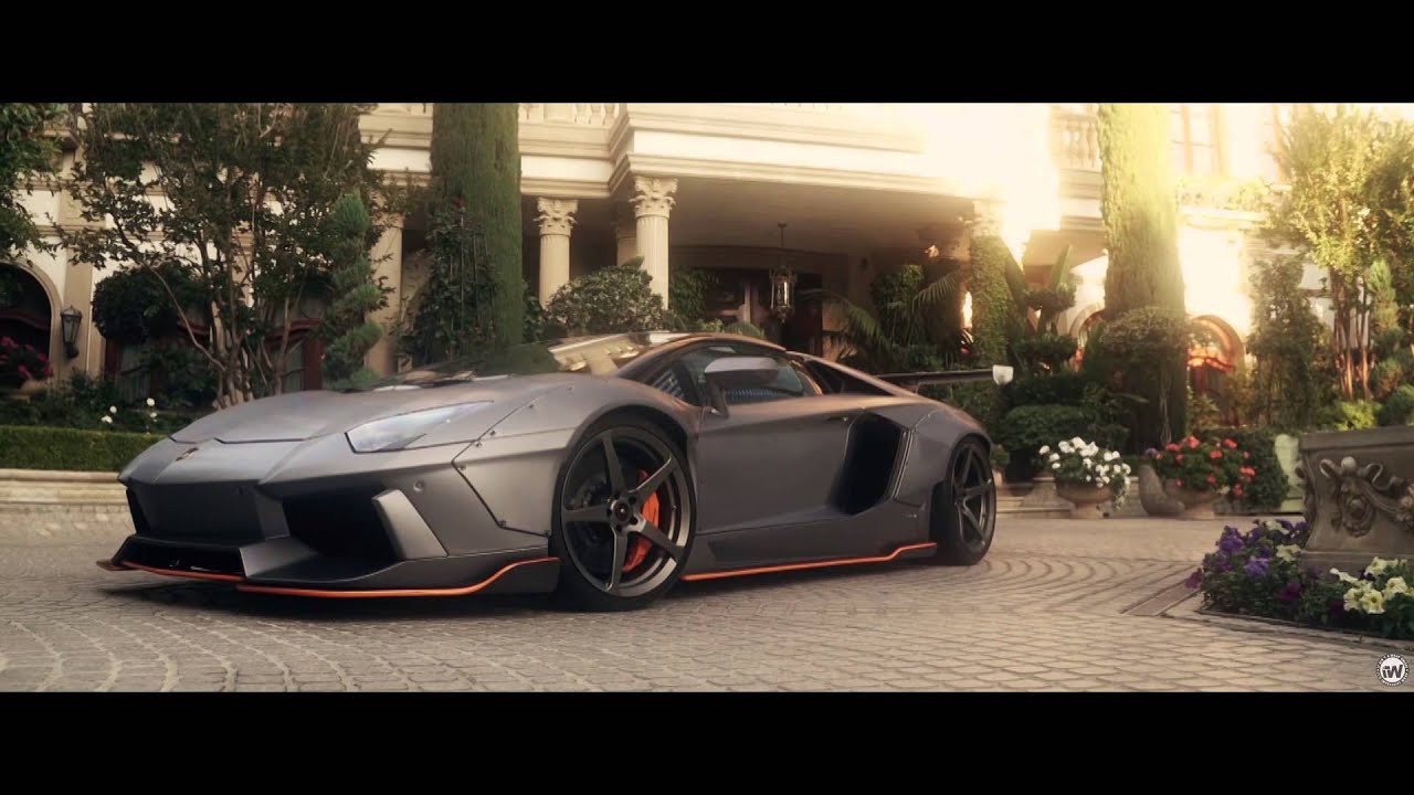 Liberty Walk Lamborghini Aventador Wrapped in brushed steel with orange accents
