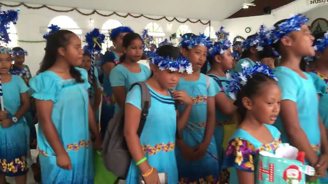 Elementary school children marching and singing at Tafunsak Church, Kosrae, December 22, 2020