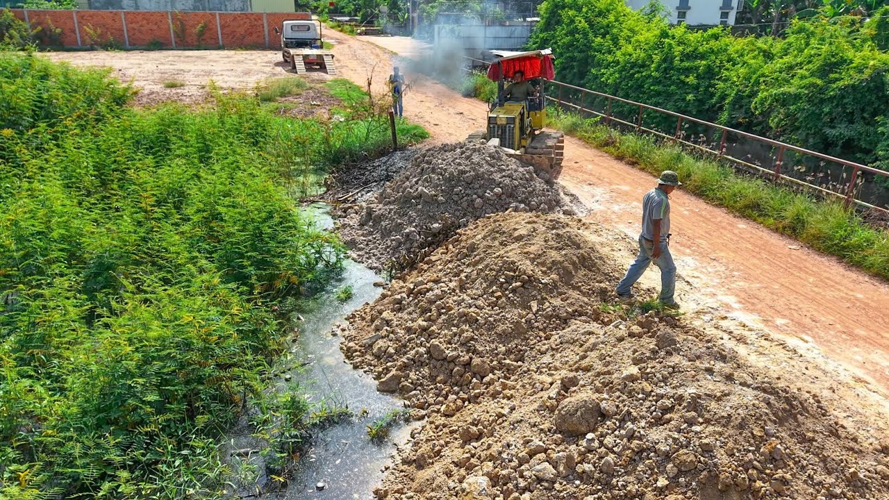 New Plan Process fill flooded in village work by Expert Bulldozer with Nissan truck 