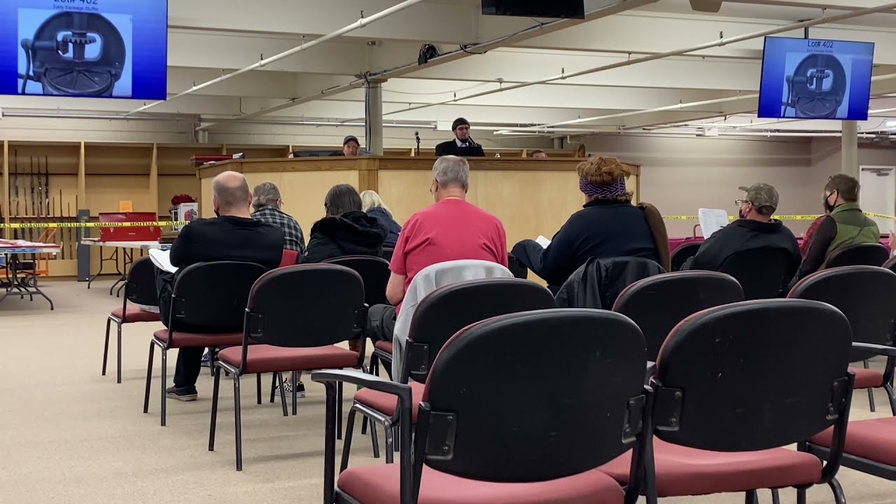 Auctioneer Selling Antiques & Collectables