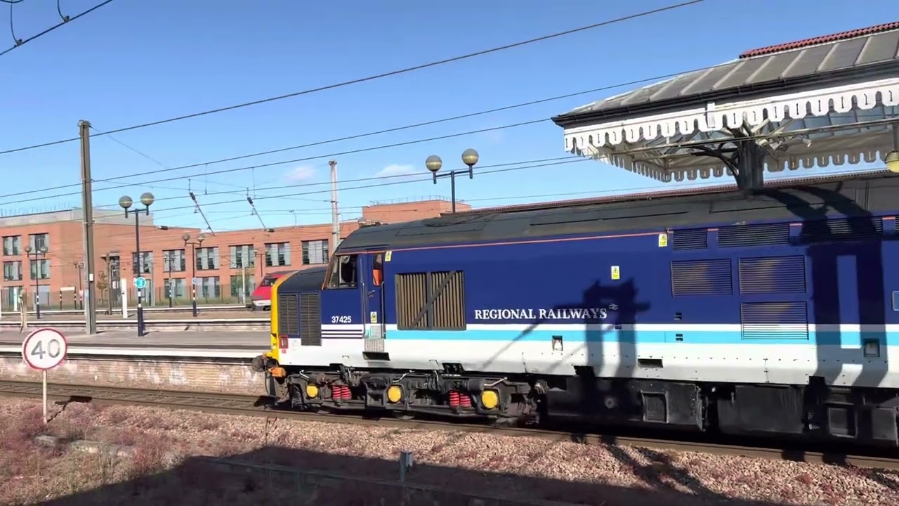 37425 &lsquo;Concrete Bob&rsquo; dragging Mk4 set with 91119 on the rear.