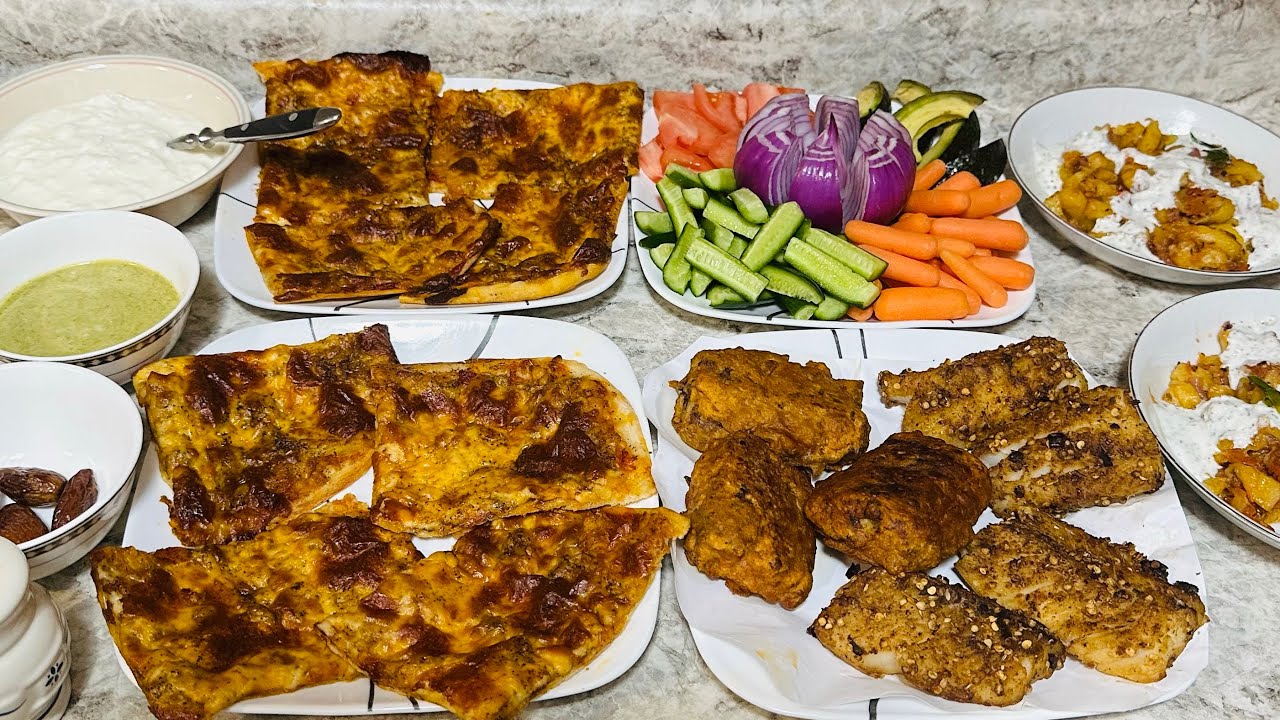 Many yummy dishes like pizza, fish, and Arab French fries 