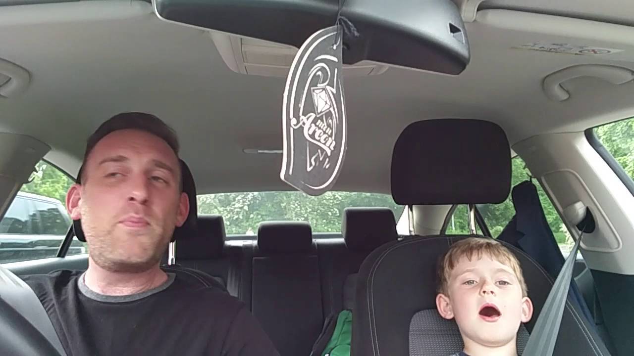 Dad and son sing Frank Sinatra in car. Original