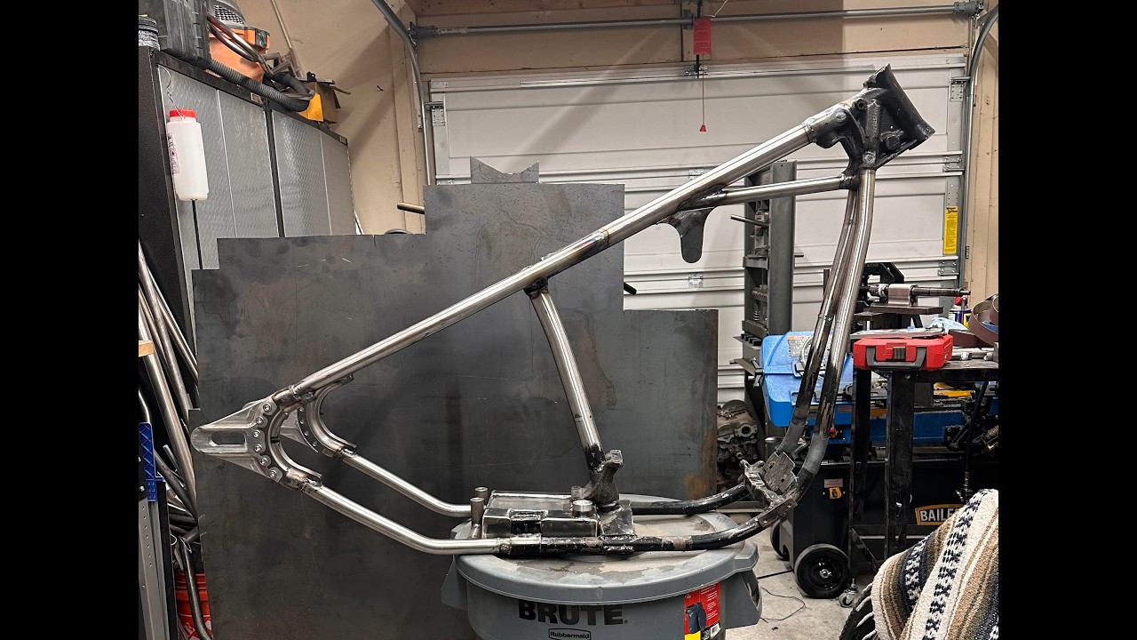 Shovelhead chopper frame using Tinworks axle plates and modified oil tank.