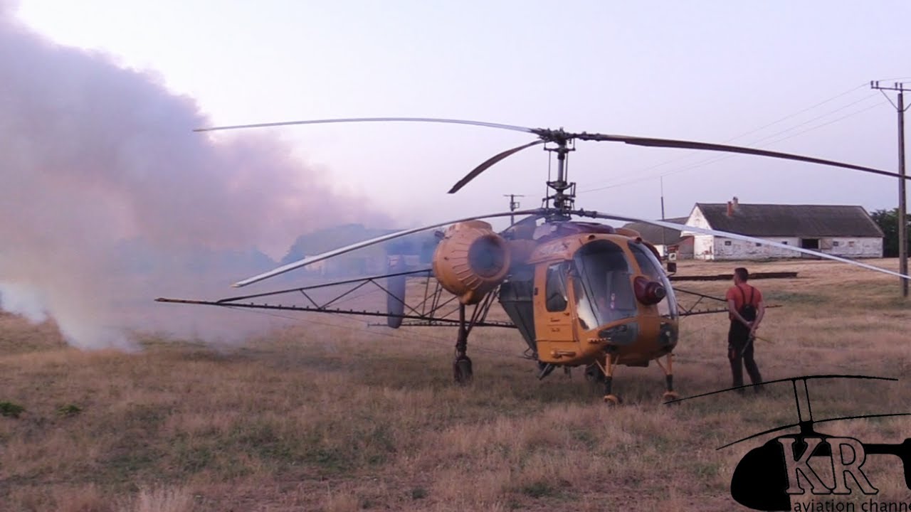 Kamov Ka-26 spraying sunflower field near Nagykarácsony, Hungary
