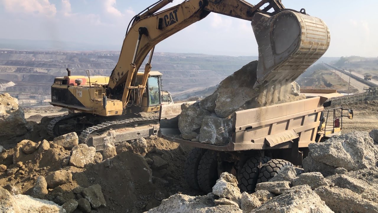 Caterpillar 375 Excavator Loading Huge Rocks On Caterpillar Dumper - Sotiriadis/ Labrianidis Mining