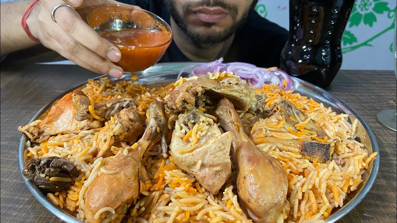 Eating Chicken Biryani with Thumbs up