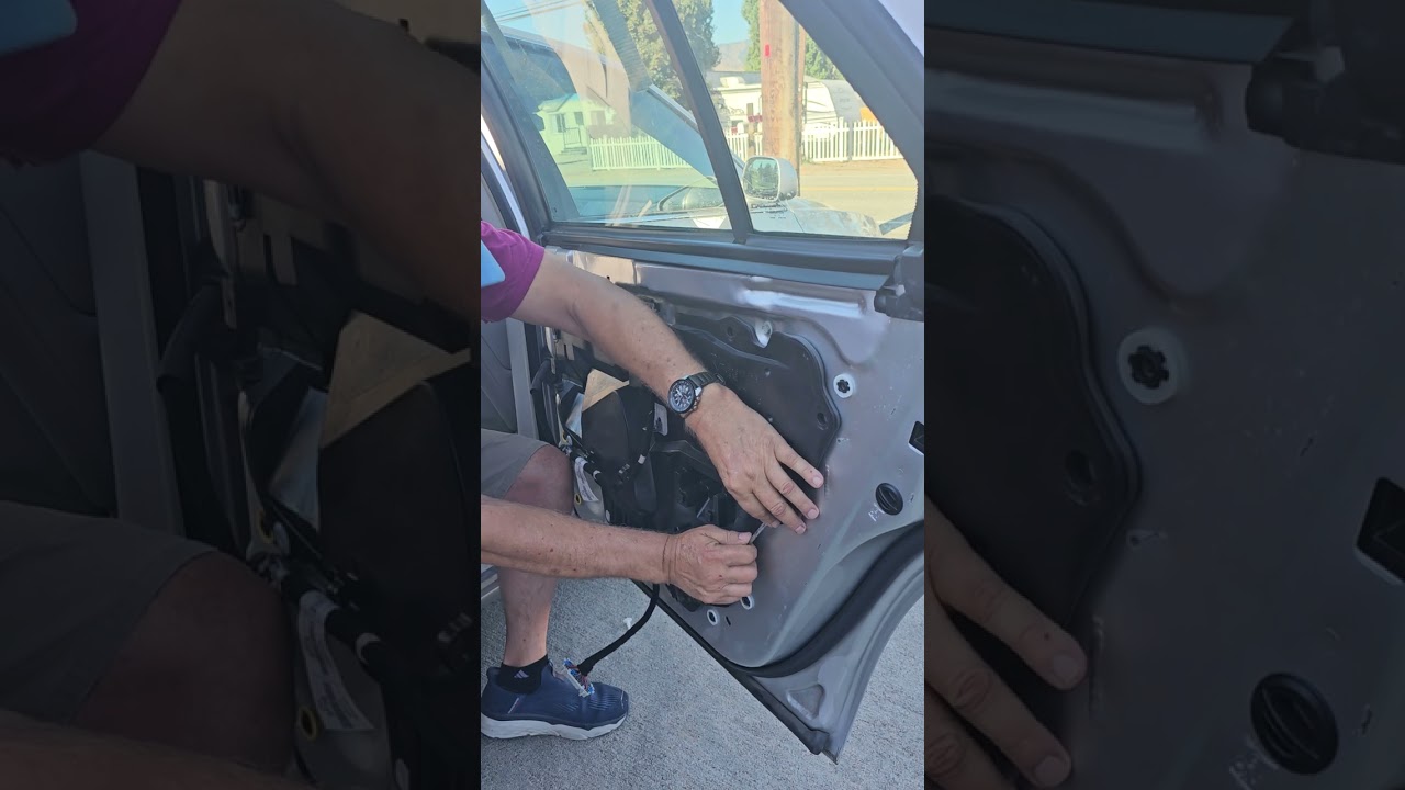 2011 Cadillac DTS door panel removal and regulator repair.