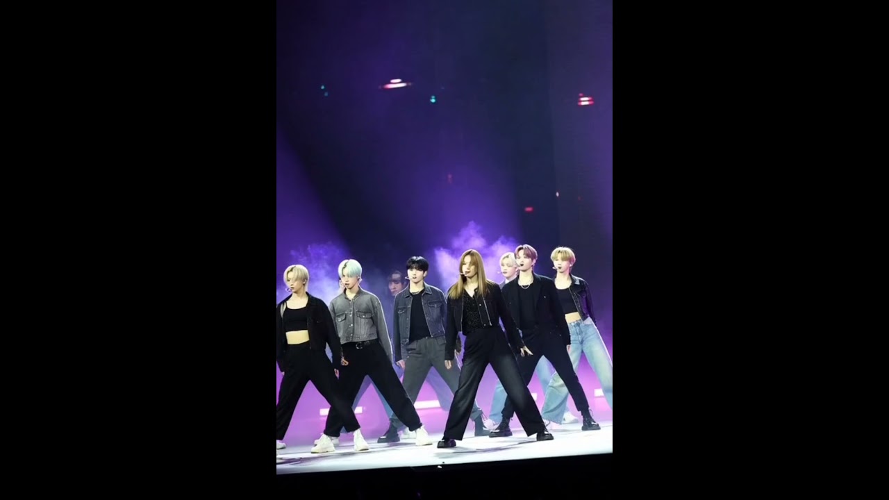 High-Energy Dance Performance on Stage with Purple Lights