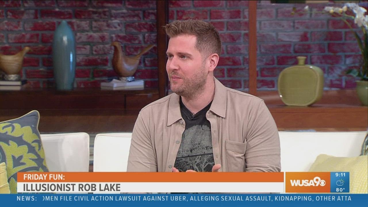 Illusionist Rob Lake shows off a card trick