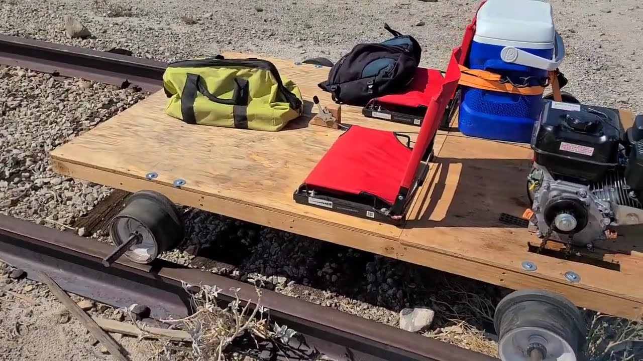 2 nerds on a homemade railroad speeder cart ride abandoned train tracks.