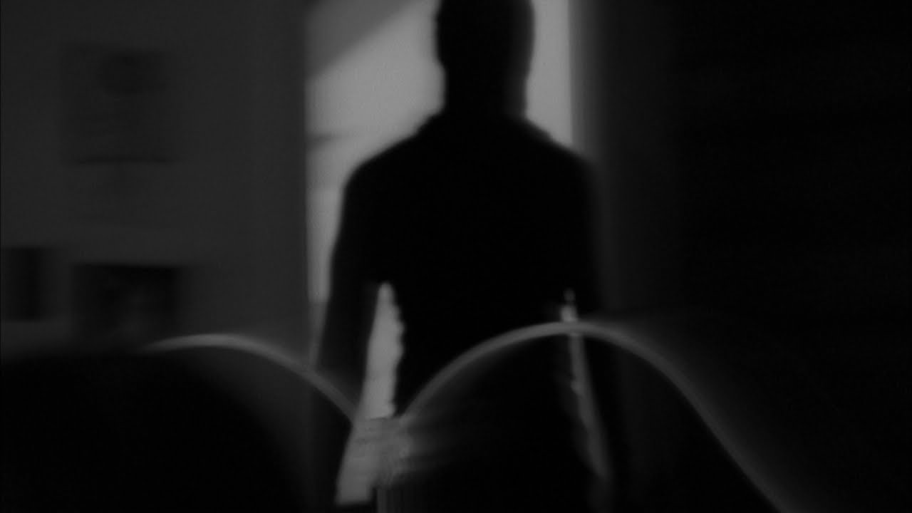 Dark Figure in Doorway