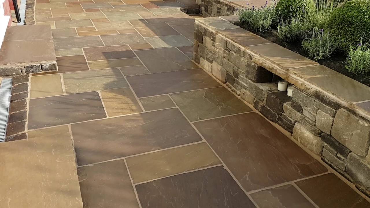 Indian stone patio, stone seating walls and firepit.