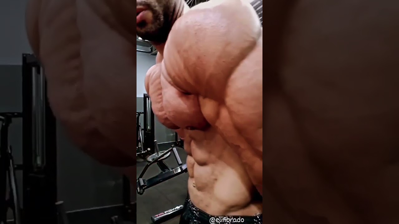 Extremely cut and ripped muscle hunk flexing his big muscles