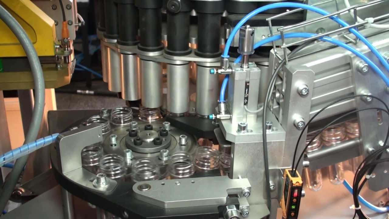 Stretch blow moulding machine Optima-4 with air-conveyor.