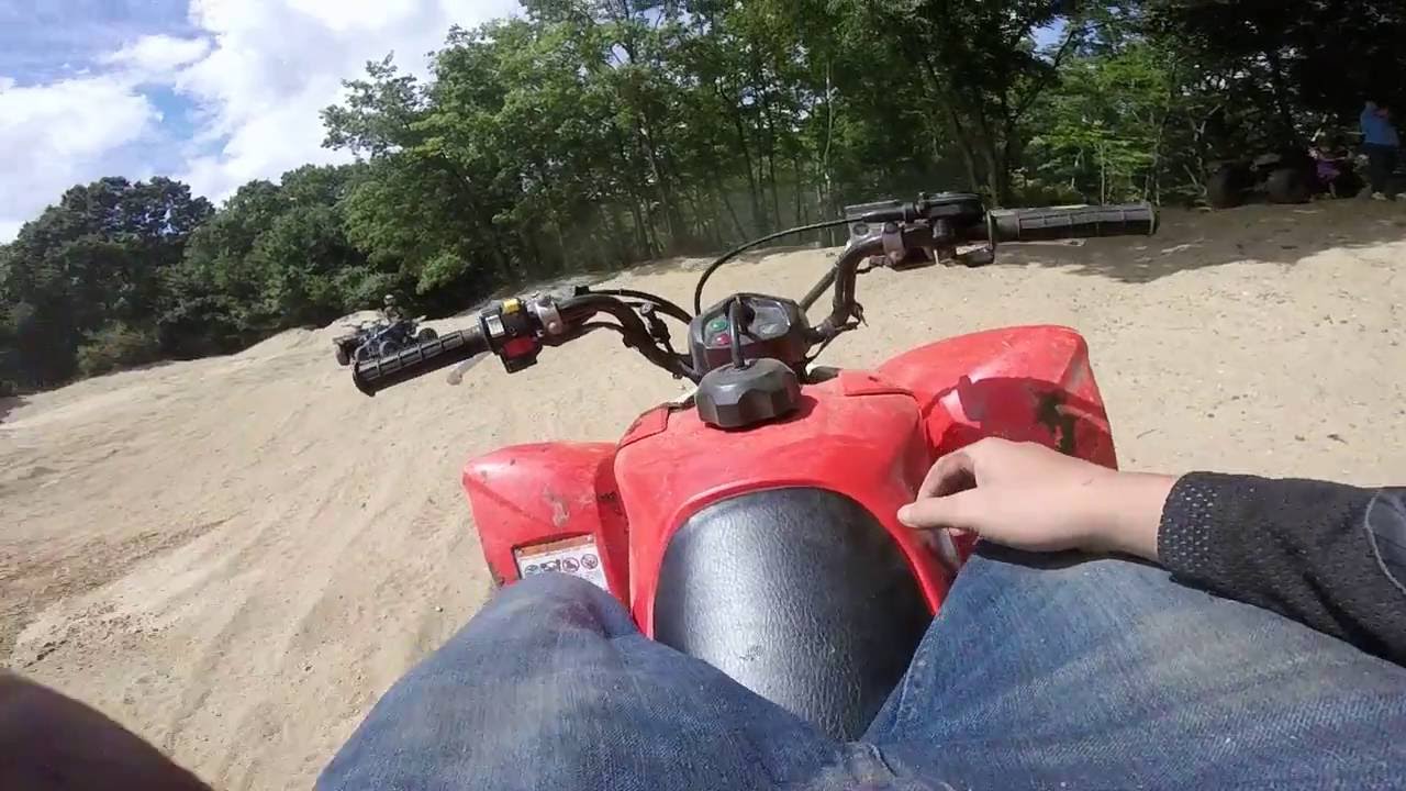 honda 250 quad playing with a banshee