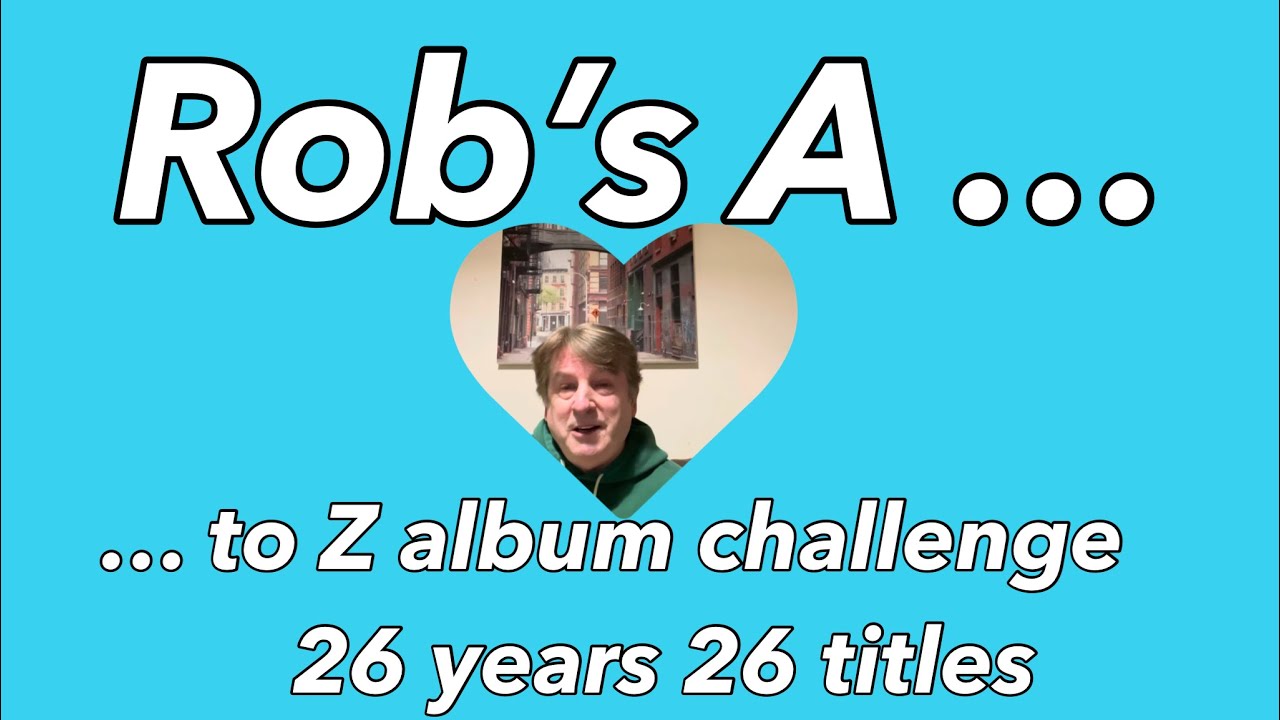 A to Z by title or artist from 1999 to 2025 via @robwalkerletthemusicplay challenge with bonus cat