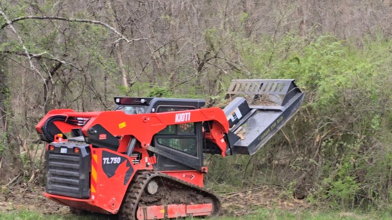 Fixing the brush hog and land clearing with a kioti TL750 compact track loader