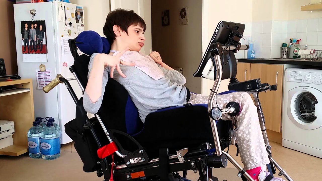 Maddy uses AAC with her knee switch