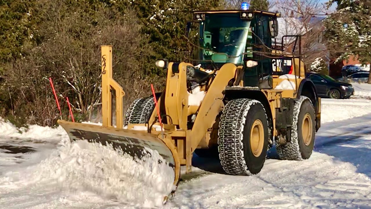 Snow Removal CAT 950m Plowing Snow with Wing