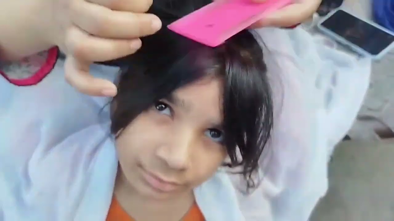 Hair checking of meerab by mom.