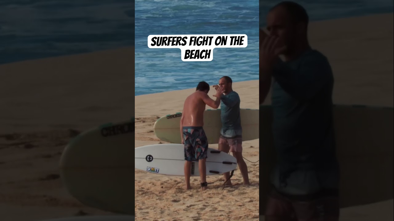 Surfers fight on the beach 