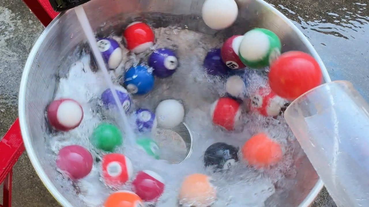 Water marble run course using transparent pipes and funnels 