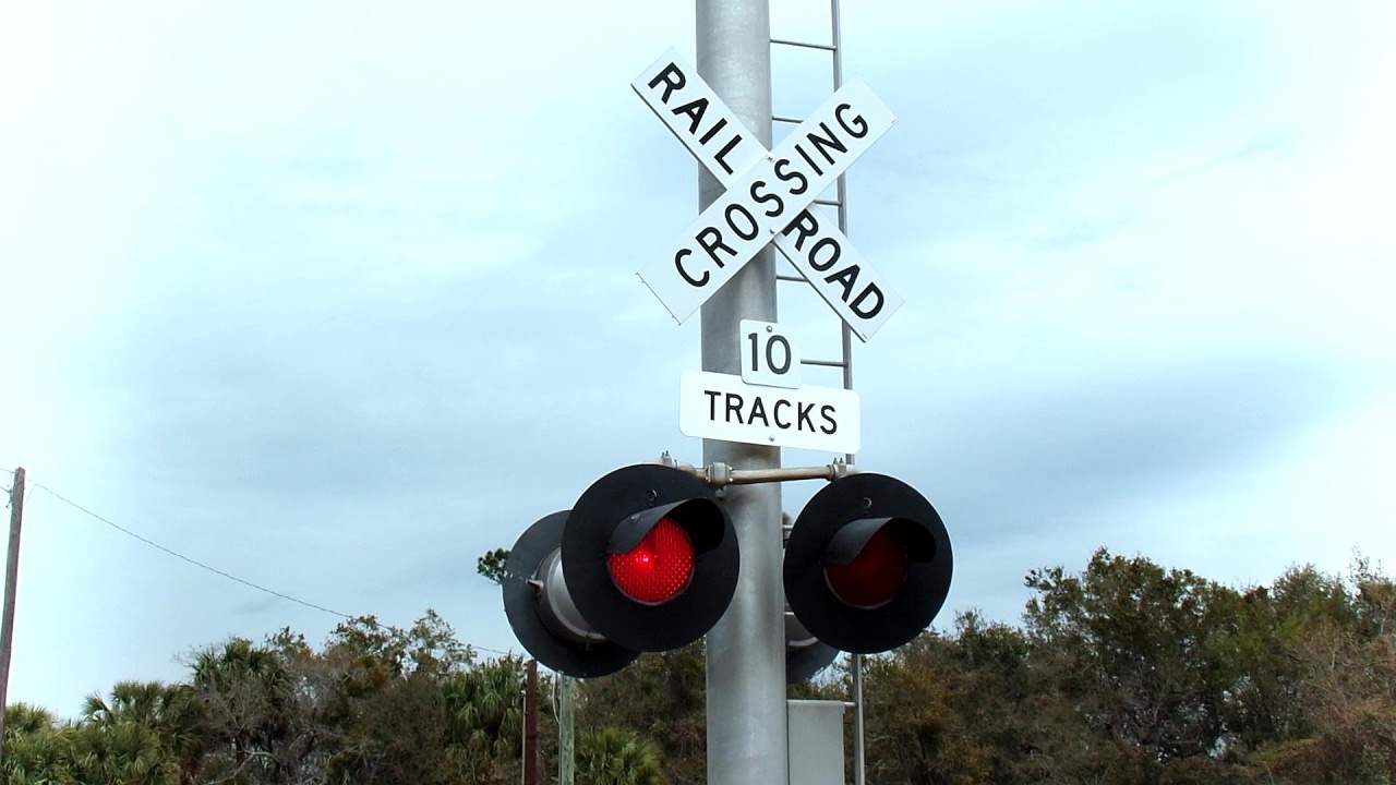 Amtrak Locomotive Almost Hits Car On 10 Track Crossing