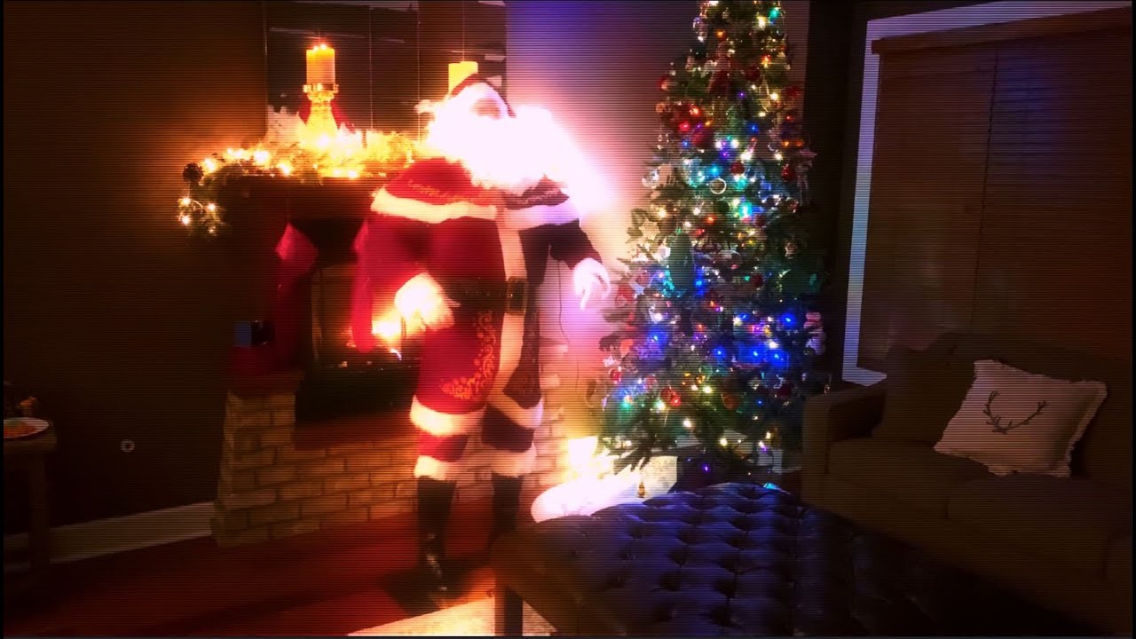Santa Claus caught on hidden camera taking a cookie break!  He really is real!