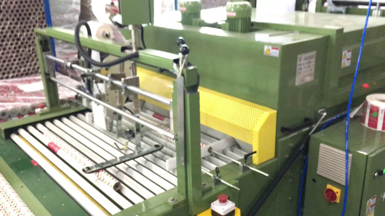 Gift paper rewinding machine and shrink wrapping machine in customer's factory